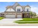 Charming two-story home with a well-kept lawn and a three car garage, perfect for a growing Gathering at 4960 Cinnabar Trl, Brownsburg, IN 46112