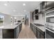 Well-equipped kitchen featuring modern appliances, a spacious island, and an open view of the living space at 4960 Cinnabar Trl, Brownsburg, IN 46112