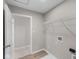 Functional laundry room with ample shelving, providing convenient storage options at 4960 Cinnabar Trl, Brownsburg, IN 46112
