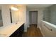 Modern bathroom with granite countertops, double sinks, and a walk-in shower at 4960 Cinnabar Trl, Brownsburg, IN 46112