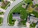 An aerial view shows the landscaped yard of this home in a suburban neighborhood at 5312 Ripplingbrook Way, Carmel, IN 46033