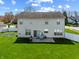 View of the home's backyard, with a patio, grilling area, large yard and privacy fence at 5312 Ripplingbrook Way, Carmel, IN 46033