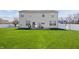 Home features a large backyard with grill, lawn swing, and plenty of green space at 5312 Ripplingbrook Way, Carmel, IN 46033