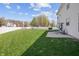 Spacious backyard with trampoline, grill, patio, and plenty of green space at 5312 Ripplingbrook Way, Carmel, IN 46033