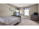 Bedroom featuring a gray bed set, desk and monitor, and a decorative world map wall art at 5312 Ripplingbrook Way, Carmel, IN 46033