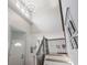 Bright entryway with a high ceiling, staircase, and modern lighting at 5312 Ripplingbrook Way, Carmel, IN 46033