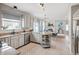 Open concept kitchen with granite countertops, stainless steel appliances, and access to living spaces at 5312 Ripplingbrook Way, Carmel, IN 46033