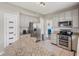 Spacious kitchen featuring stainless steel appliances, granite countertops, and a convenient layout at 5312 Ripplingbrook Way, Carmel, IN 46033