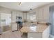 Well-equipped kitchen with granite countertops, stainless steel appliances, and ample cabinet space at 5312 Ripplingbrook Way, Carmel, IN 46033