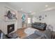 Inviting living room featuring a fireplace, comfortable seating, and stylish decor at 5312 Ripplingbrook Way, Carmel, IN 46033