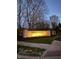 Stone entrance sign for Spring Creek neighborhood with illuminated lettering at dusk at 5312 Ripplingbrook Way, Carmel, IN 46033