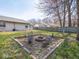 Cozy backyard featuring a charming fire pit area for outdoor gatherings and relaxation with comfortable chairs at 5512 Straw Hat Dr, Indianapolis, IN 46237