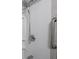 Accessible bathroom featuring safety grab bar and adjustable handheld shower head at 5512 Straw Hat Dr, Indianapolis, IN 46237