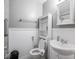 This bathroom has wainscotting, a toilet, and a sink at 5512 Straw Hat Dr, Indianapolis, IN 46237