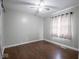 Standard bedroom with hardwood floors and ceiling fan at 5512 Straw Hat Dr, Indianapolis, IN 46237