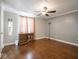 Spacious bedroom featuring hardwood floors and a ceiling fan at 5512 Straw Hat Dr, Indianapolis, IN 46237