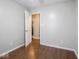 Empty bedroom with hardwood floors and a large doorway at 5512 Straw Hat Dr, Indianapolis, IN 46237