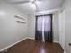 This bedroom has hardwood floors, shelves, and a ceiling fan at 5512 Straw Hat Dr, Indianapolis, IN 46237