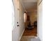 View of the foyer with hardwood floors that transitions into an open living space at 5512 Straw Hat Dr, Indianapolis, IN 46237