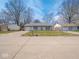 Charming single-story home with a well-maintained front yard and attached garage in a residential neighborhood at 5512 Straw Hat Dr, Indianapolis, IN 46237