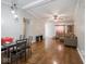 A living room with wood floors, vaulted ceilings, and a dining area at 5512 Straw Hat Dr, Indianapolis, IN 46237