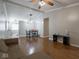 Cozy living room with hardwood floors and a dining area, perfect for entertaining and relaxation at 5512 Straw Hat Dr, Indianapolis, IN 46237