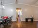 A view of the hardwood floored living room leading into a hallway at 5512 Straw Hat Dr, Indianapolis, IN 46237