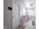 This mud room has tile floors, a white door, and a storage unit at 5512 Straw Hat Dr, Indianapolis, IN 46237