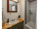 Bathroom featuring vanity with green cabinets, wood top, and bath tub with shower at 5973 Masten Rd, Coatesville, IN 46121