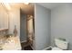 Bathroom featuring tub with shower, toilet and a vanity with sink at 5973 Masten Rd, Coatesville, IN 46121