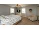 Cozy bedroom featuring a comfortable bed, chair and natural light at 5973 Masten Rd, Coatesville, IN 46121