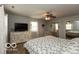 Bright bedroom with a comfortable bed, dresser, and natural light from the windows at 5973 Masten Rd, Coatesville, IN 46121
