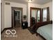 Bedroom with exercise equipment and a window with patterned curtains at 5973 Masten Rd, Coatesville, IN 46121
