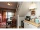 Dining area features a light fixture and dining set near kitchen space at 5973 Masten Rd, Coatesville, IN 46121