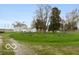 Home exterior with large yard and driveway at 5973 Masten Rd, Coatesville, IN 46121