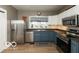 Well-appointed kitchen featuring stainless steel appliances and neutral-toned cabinetry at 5973 Masten Rd, Coatesville, IN 46121