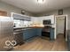 Well-appointed kitchen featuring stainless steel appliances and neutral-toned cabinetry at 5973 Masten Rd, Coatesville, IN 46121