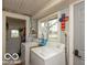 Laundry room featuring a washing machine, dryer and a window for natural light at 5973 Masten Rd, Coatesville, IN 46121