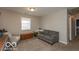 Cozy living room featuring a window, gray sofa and a side chair at 5973 Masten Rd, Coatesville, IN 46121