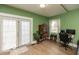 Bright room featuring french doors, a decorative cabinet, and hardwood floors at 5973 Masten Rd, Coatesville, IN 46121