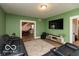 Inviting living room with a large sofa, decorative rug, and a television at 5973 Masten Rd, Coatesville, IN 46121