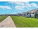 Backyard view of homes with a walking trail and a manicured lawn, promoting community and outdoor living at 622 Ehrlich Ln, Westfield, IN 46074