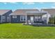 Spacious backyard with a covered patio, perfect for outdoor living, with a well-maintained lawn and garden at 622 Ehrlich Ln, Westfield, IN 46074