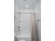 Clean bathroom with white subway tile, a bathtub with shower, and a stylish shower curtain, offering a refreshing space at 622 Ehrlich Ln, Westfield, IN 46074