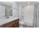Well-lit bathroom features a vanity with ample storage, a shower with white subway tiles, and modern fixtures at 622 Ehrlich Ln, Westfield, IN 46074