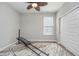 Light and airy bedroom featuring neutral walls and ceiling fan with a closet and a workout machine at 622 Ehrlich Ln, Westfield, IN 46074