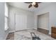 Neutral bedroom with wood-look floors, ceiling fan, closet and a workout machine to stay in shape at 622 Ehrlich Ln, Westfield, IN 46074