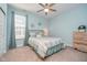 Serene bedroom featuring a cozy bed, soft blue walls, and natural light, creating a tranquil and inviting space at 622 Ehrlich Ln, Westfield, IN 46074
