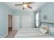 Bright bedroom with a ceiling fan, comfortable bed, and ample closet space, perfect for relaxation and storage at 622 Ehrlich Ln, Westfield, IN 46074