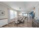 Open dining room with wood floors, modern lighting and seating for six at 622 Ehrlich Ln, Westfield, IN 46074